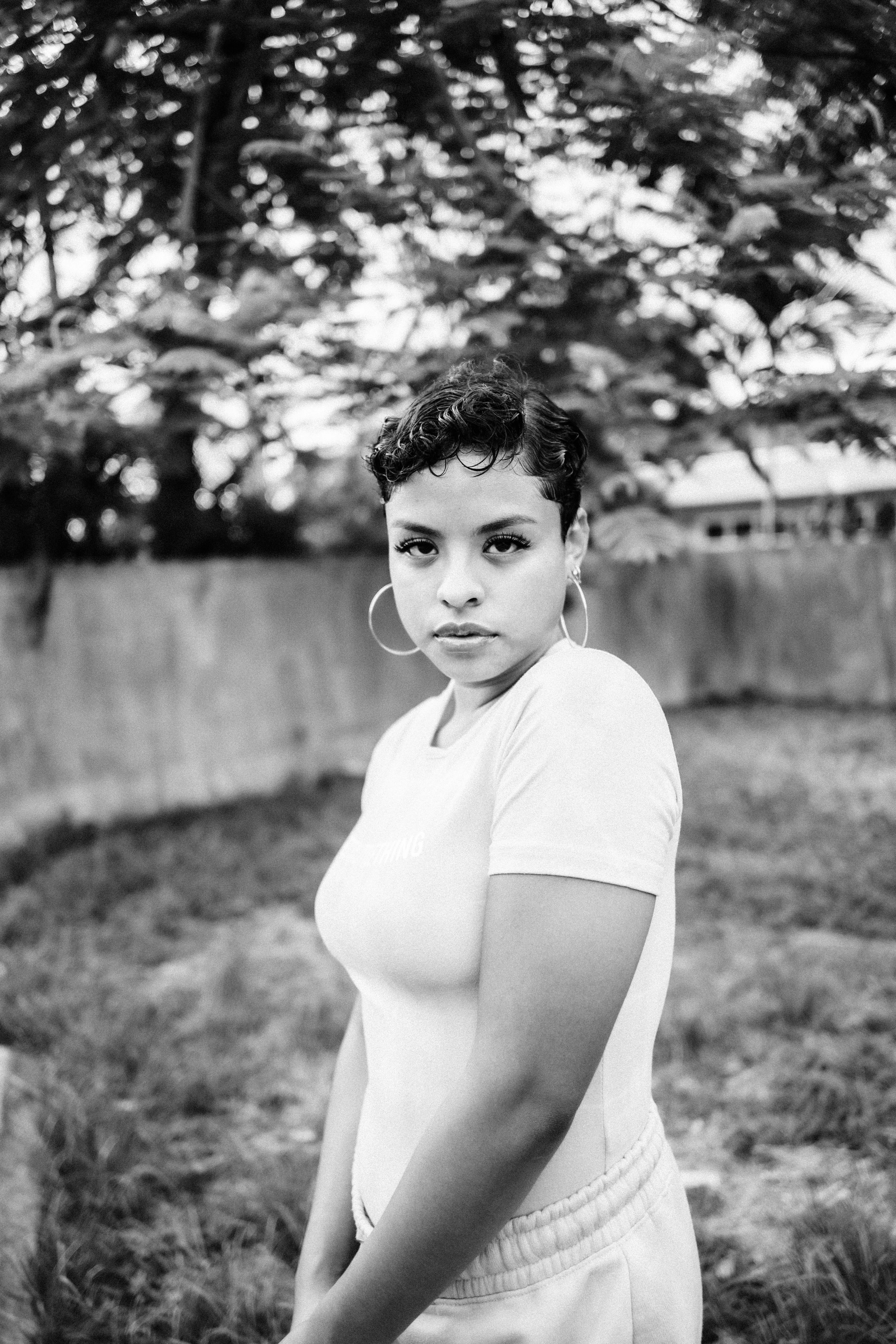 grayscale photo of woman in t-shirt